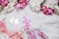 omen\'s lace lingerie on a white bed. Tulips, perfume, lipstick, condoms. Flat lay with copy Royalty Free Stock Photo