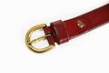 Women`s leather old Burgundy belt with buckle on white background