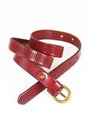 Women`s leather old Burgundy belt with buckle on white background