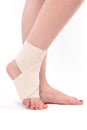 Women`s leg tied with an elastic bandage, ankle foot