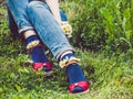 Women`s legs, fashionable shoes and bright socks Royalty Free Stock Photo