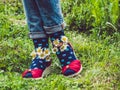 Women`s legs, fashionable shoes and bright socks Royalty Free Stock Photo