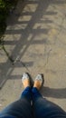 Women's legs in jeans and modern moccasins, top view