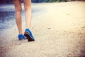Women's legs running or walking along the beach. Royalty Free Stock Photo