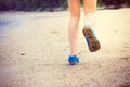 Women's legs running or walking along the beach. Royalty Free Stock Photo