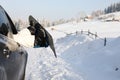 Women,s legs in snowboard from the car near beauty view of mountains and christmas trees in winter Royalty Free Stock Photo