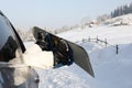 Women,s legs in snowboard from the car near beauty view of mountains and christmas trees in winter Royalty Free Stock Photo