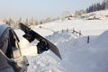 Women,s legs in snowboard from the car near beauty view of mountains and christmas trees in winter Royalty Free Stock Photo