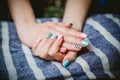 Women's manicure on a background of crocodile skins