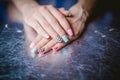 Women's manicure on a silver background