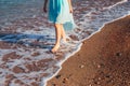 Women`s and men`s feet in the sand Royalty Free Stock Photo