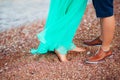 Women`s and men`s feet in the sand Royalty Free Stock Photo