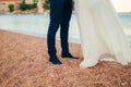 Women`s and men`s feet in the sand Royalty Free Stock Photo