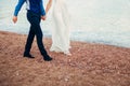 Women`s and men`s feet in the sand Royalty Free Stock Photo