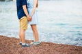 Women`s and men`s feet in the sand Royalty Free Stock Photo