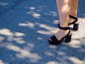 Women`s or men`s feet in summer in the city