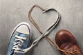 Women`s and men`s shoes with a laces from the heart Royalty Free Stock Photo