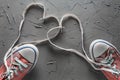 Women`s and men`s shoes with a laces from the heart Royalty Free Stock Photo