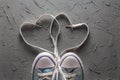 Women`s and men`s shoes with a laces from the heart Royalty Free Stock Photo