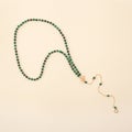 Women`s necklace of green malachite gem stones Royalty Free Stock Photo