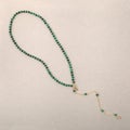 Women`s necklace of green malachite gem stones Royalty Free Stock Photo