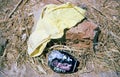 Women`s panties and empty coca cola lying on dry and yellow grass