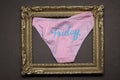 Friday pink panties in a wooden photo frame Royalty Free Stock Photo