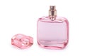 Women`s perfume in beautiful pink bottle isolated on white background, luxury smell, crystall glass Royalty Free Stock Photo