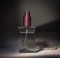 Women's perfume and string of pearls Royalty Free Stock Photo