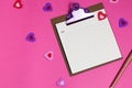 Women's pink office desk. Notepad, pen, stickers on a pink background. Flat lay, top view, copy space, banner