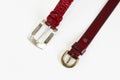 Women`s red leather belts with buckle on white background Royalty Free Stock Photo