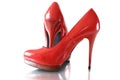 Women`s red shoes with high heels on a gray background Royalty Free Stock Photo