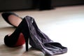 Women`s sexy underwear Laying on the floor with black heels Bedroom background Royalty Free Stock Photo