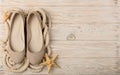 Women`s shoes beige color on a wooden background. Royalty Free Stock Photo