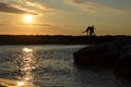 Women's silhouettes by sunrise at sea