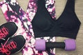 Women`s sport wear and Dumbbell, Sport accessories and fashion.