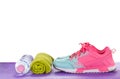 Women`s Sports Shoes, Water Bottles, Towels on a fitness pad ,isolated on white background Royalty Free Stock Photo