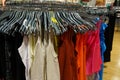 Women's tank tops hang on hangers in a clothing store. Royalty Free Stock Photo