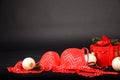 Women`s underwear bra red lace, Christmas tree toys and a gift box with a red bow and fir branches. Royalty Free Stock Photo