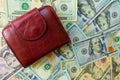 Women`s wallet on dolar notes. Royalty Free Stock Photo