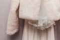 Women`s white cape made of artificial fur wool wedding element fragment object clothes of the bride Royalty Free Stock Photo