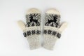 Women`s winter knitted mittens on a white background Royalty Free Stock Photo