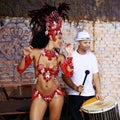 Women, samba dancer and carnival with smile, stage and band with fashion, culture or creativity in nightclub. Girl