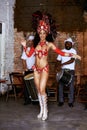 Women, samba dancer and happy at carnival, stage and band with fashion, culture and creativity in nightclub. Girl