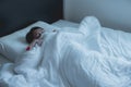 Woman with scare and panic while lying down under the blanket in bedroom,Nightmare or bad dream Royalty Free Stock Photo