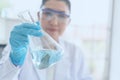 Women scientist doing test in laboratory. Women scientist doing some research with dropper chemical testing