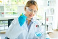 Women scientist research and looking chemistry liquid in a laboratory. Health care concept, scientific experiment working in lab Royalty Free Stock Photo