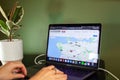 A women searches real estate listings under 1 million dollars to buy a house in Vancouver on a map