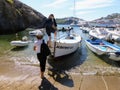 Women get on a small boat in the island of Ponza in Italy.