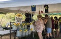 Women select sunflowers and items at gift stand at the Sussex County Sunflower Maze